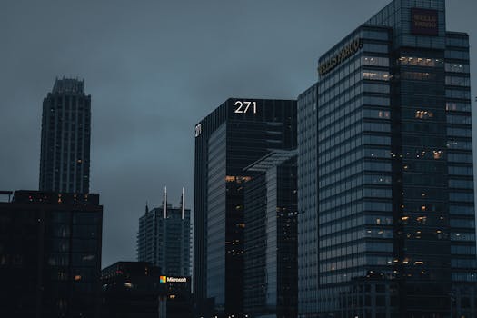 Urban evening skyline with towering architecture in Atlanta, Georgia, exuding a dark, moody atmosphere.