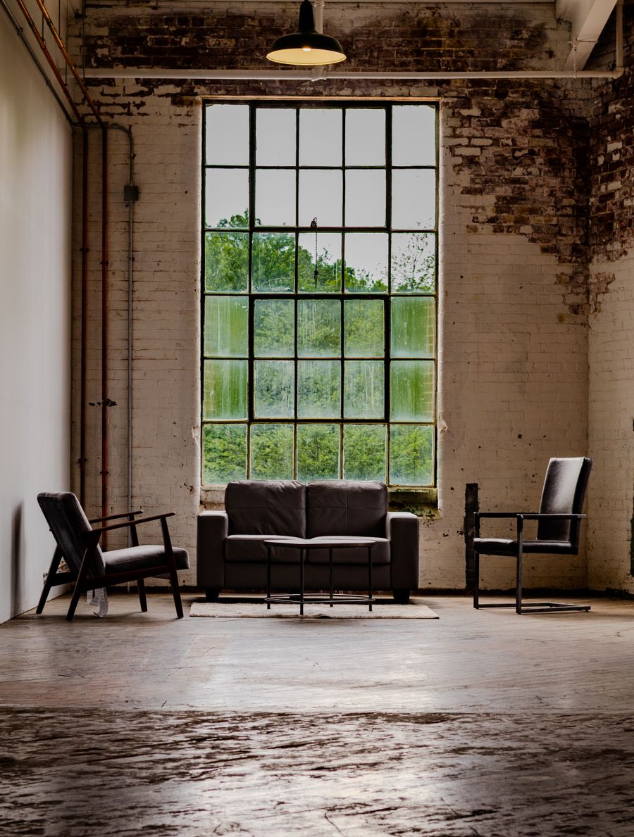 Warehouse apartment with steel windows, exposed concrete and oak joinery
