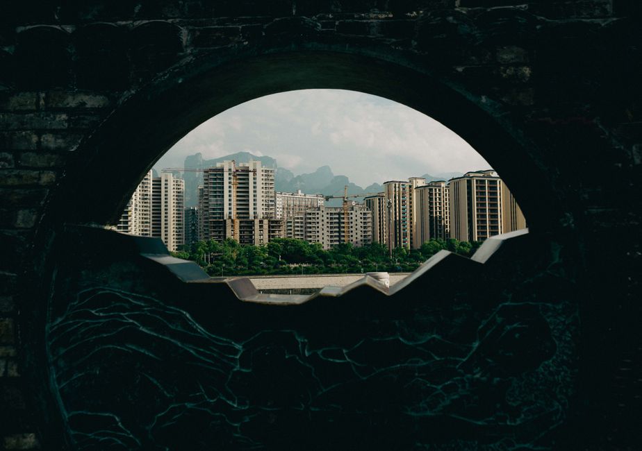 View of Zhangjiajie's modern skyline framed by traditional architecture.