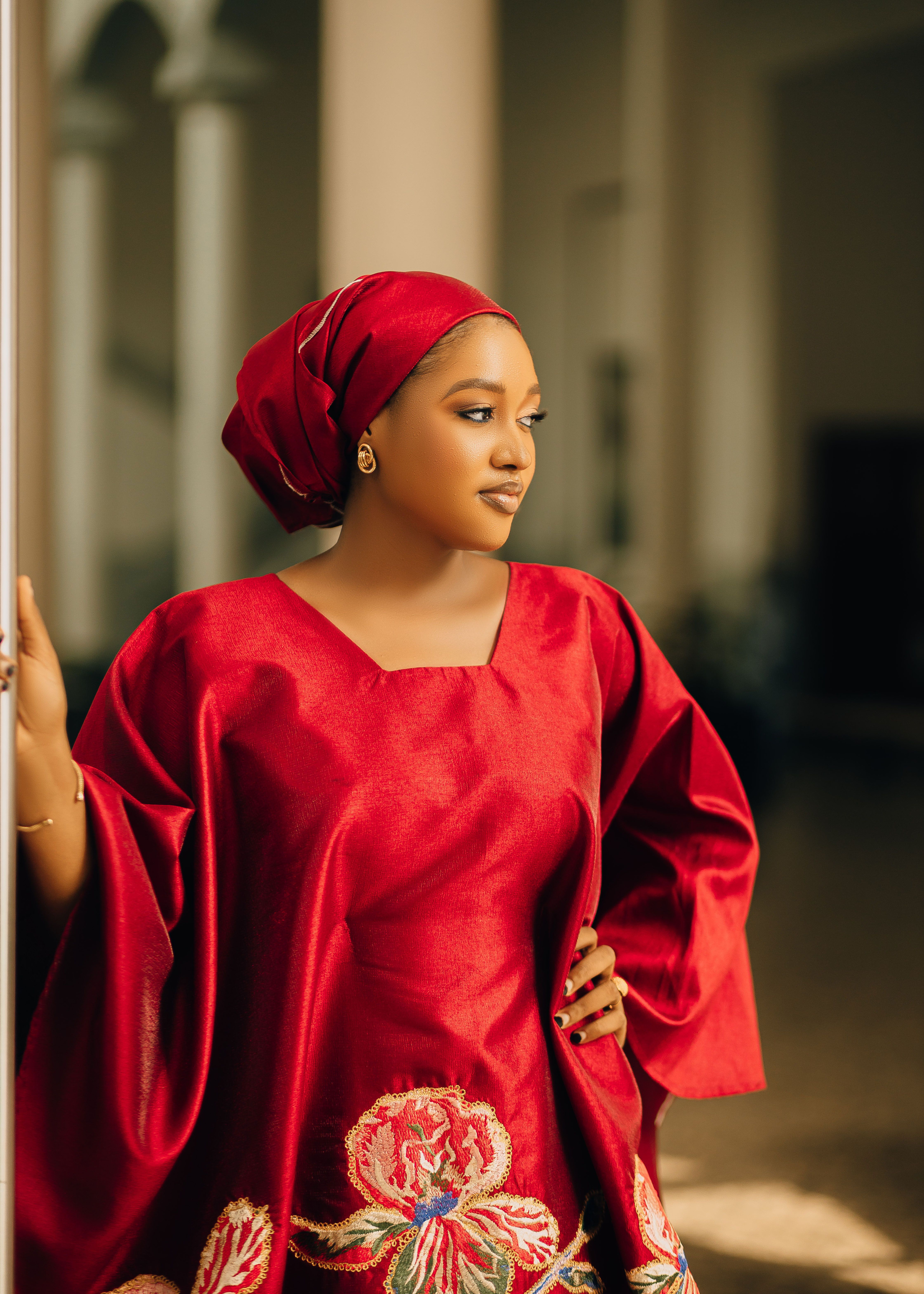Elegant Woman in Vibrant Red Traditional Attire · Free Stock Photo