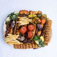 Mixed grill platter with kebabs — photo by J KREATOR on Pexels