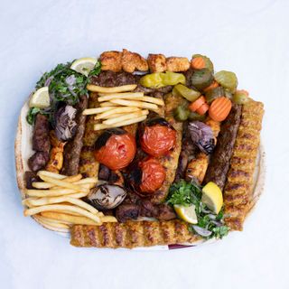 Mixed charcoal-grill platter with skewers and vegetables, photo by J KREATOR on Pexels