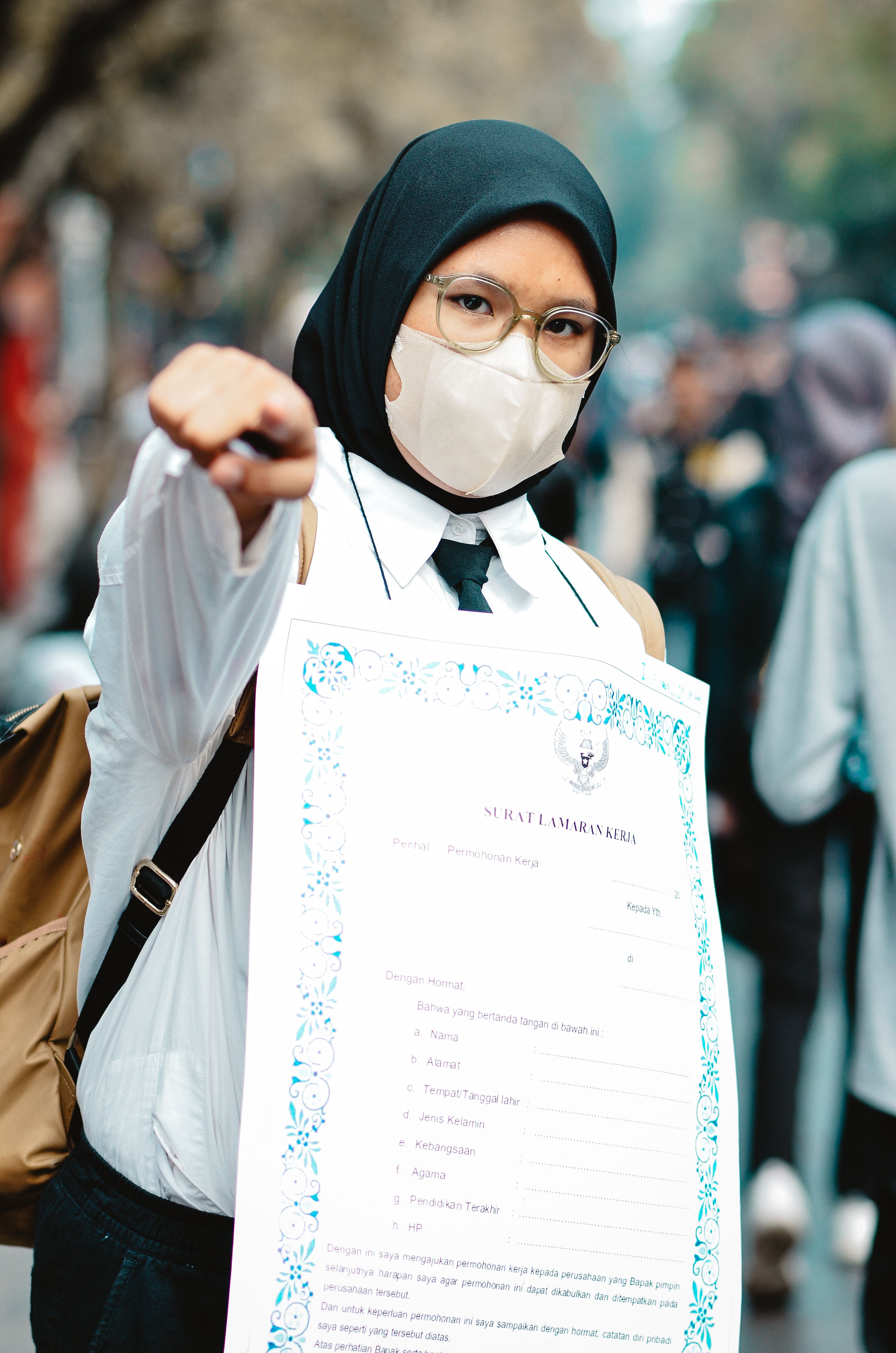 Masked Cosplayer Holding Certificate at Outdoor Event
