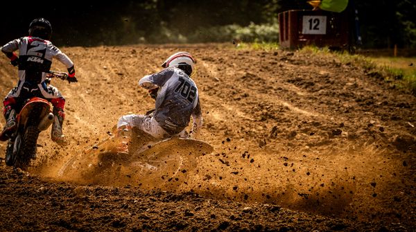 Motocross action on a sunlit dirt track, L'oeil a deux Vanessa et cedric on Pexels