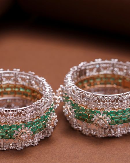 Sparkling zircon bangles with emerald-green accents