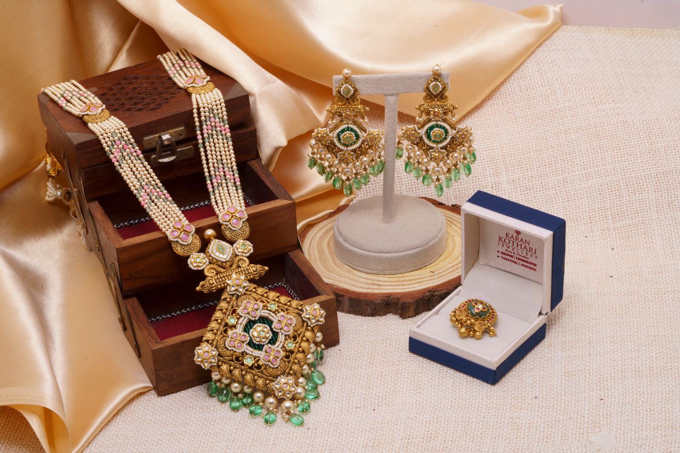 Traditional Indian gold jewellery set with necklace earrings and ring