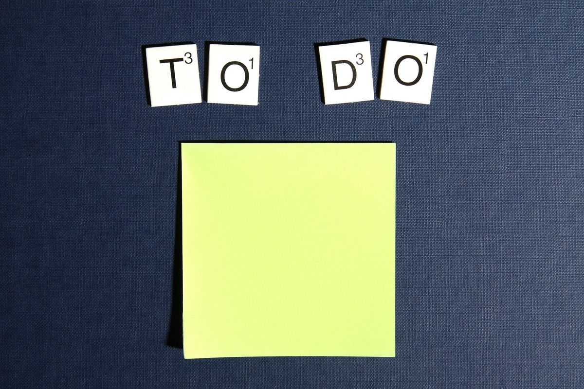 Sticky notes and to-do list with scattered tasks