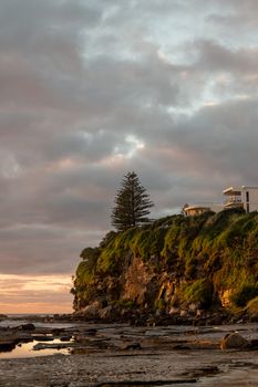 Dramatic ocean cliffs at sunrise on the Sunshine Coast, Queensland, Australia.