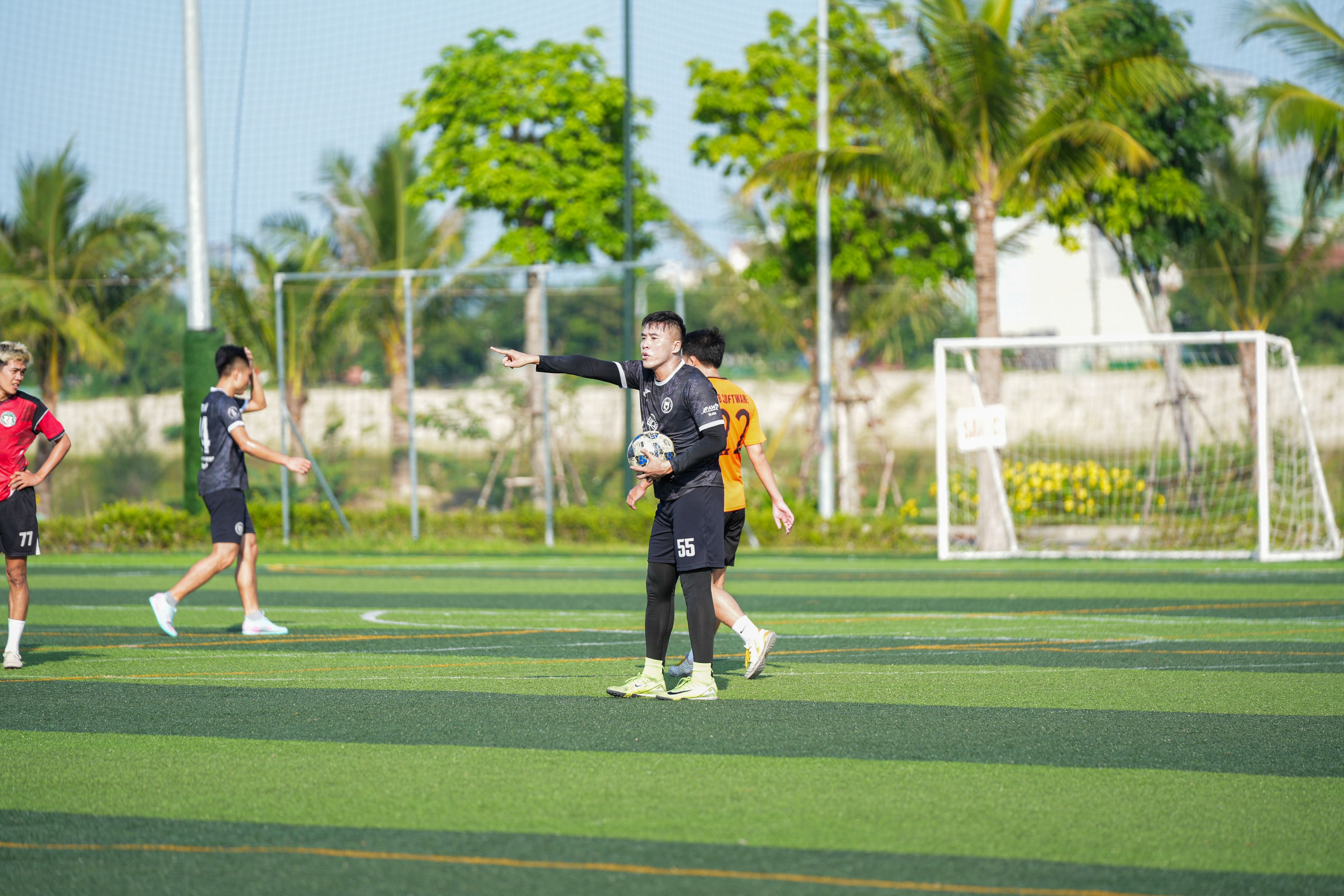 Soccer Players on Sunny Outdoor Field · Free Stock Photo