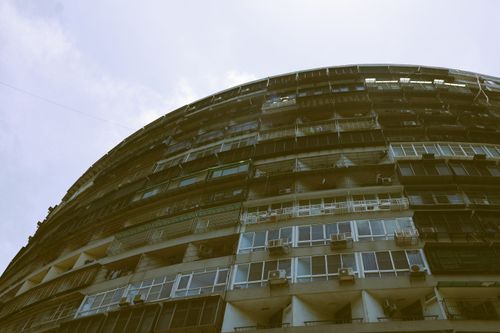 Free Explore the unique curved architecture of a residential building under a bright sky in Taiwan. Stock Photo