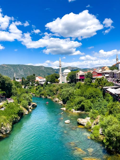 Free Idyllic landscape view of Neretva River and Mostar with clear blue sky. Stock Photo