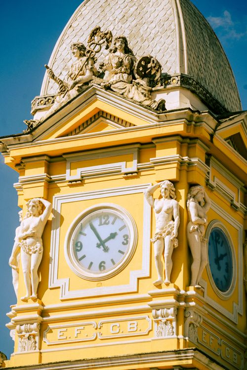 Free Artistic clock tower with classical sculptures in Minas Gerais, Brazil. Stock Photo