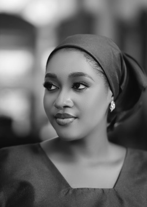 Free Artistic black and white portrait of a woman with a headscarf, showcasing beauty and elegance. Stock Photo