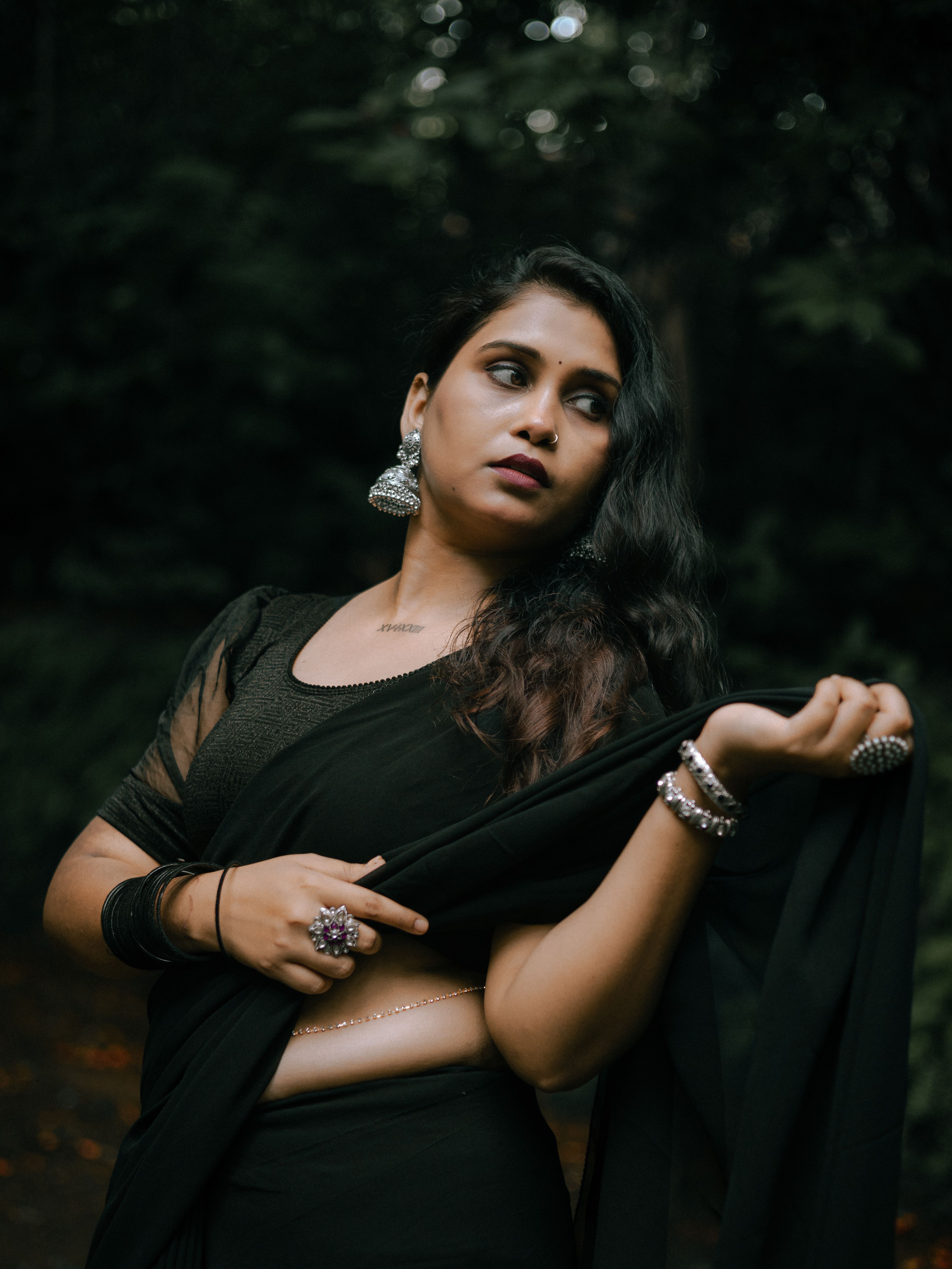 Elegant Woman Posing in Black Saree Outdoors · Free Stock Photo