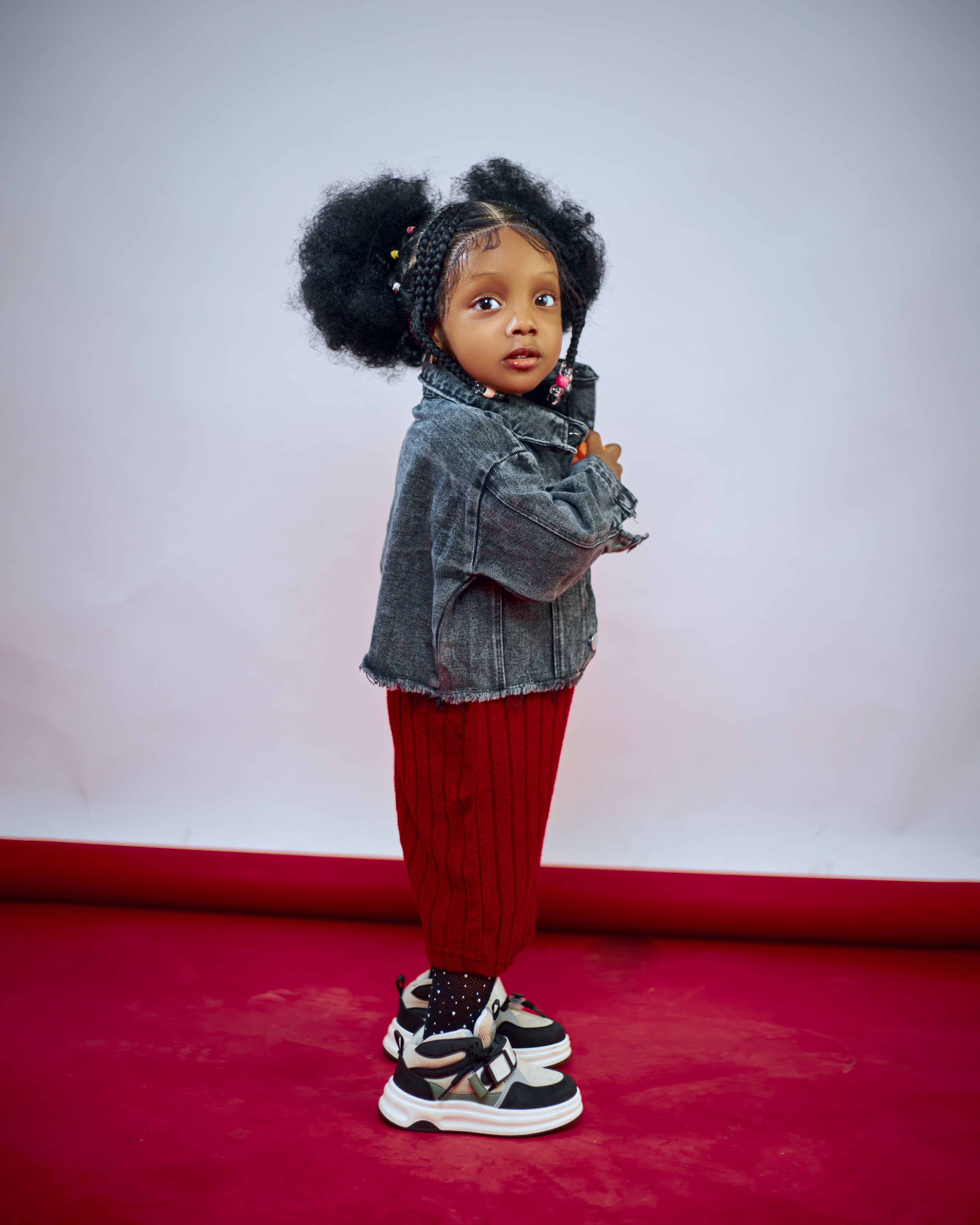 Adorable Toddler in Denim Jacket Posing Stylishly · Free Stock Photo