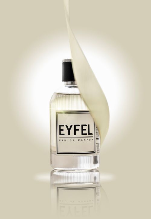 Free Stylish shot of EYFEL Eau de Parfum with decorative leaf wrap. Stock Photo