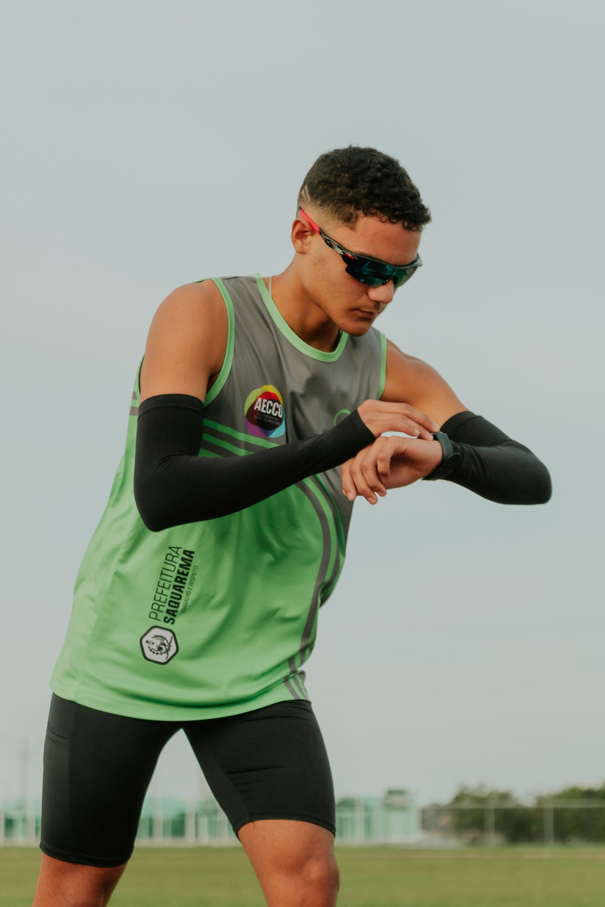 Runner checking a smartwatch mid-workout to stay on threshold pace