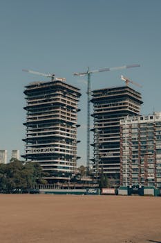 High-rise buildings under construction in Buenos Aires, Argentina with cranes.