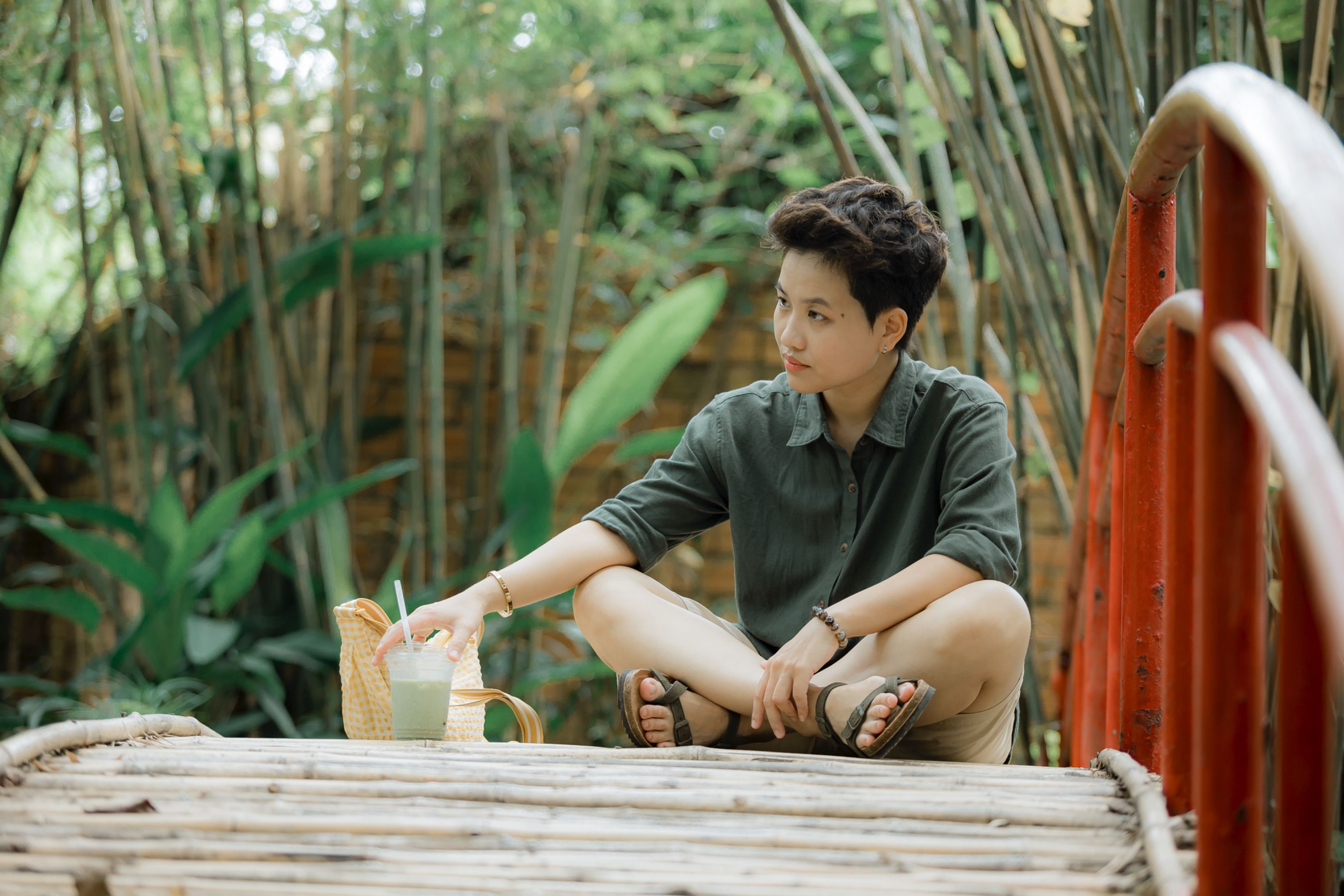 woman drinking green smoothie morning