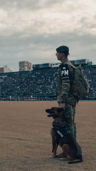 soldier using mine detector in field