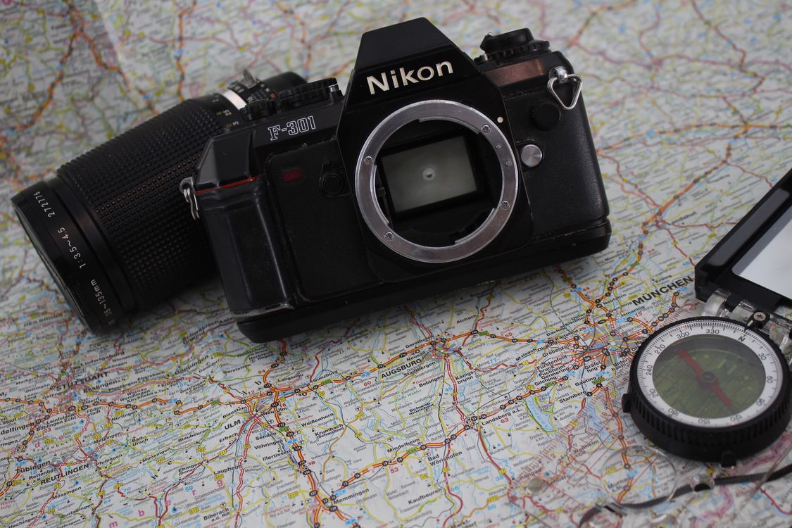 Compass Map Camera Vintage Camera and Compass on World Map · Free Stock Photo
