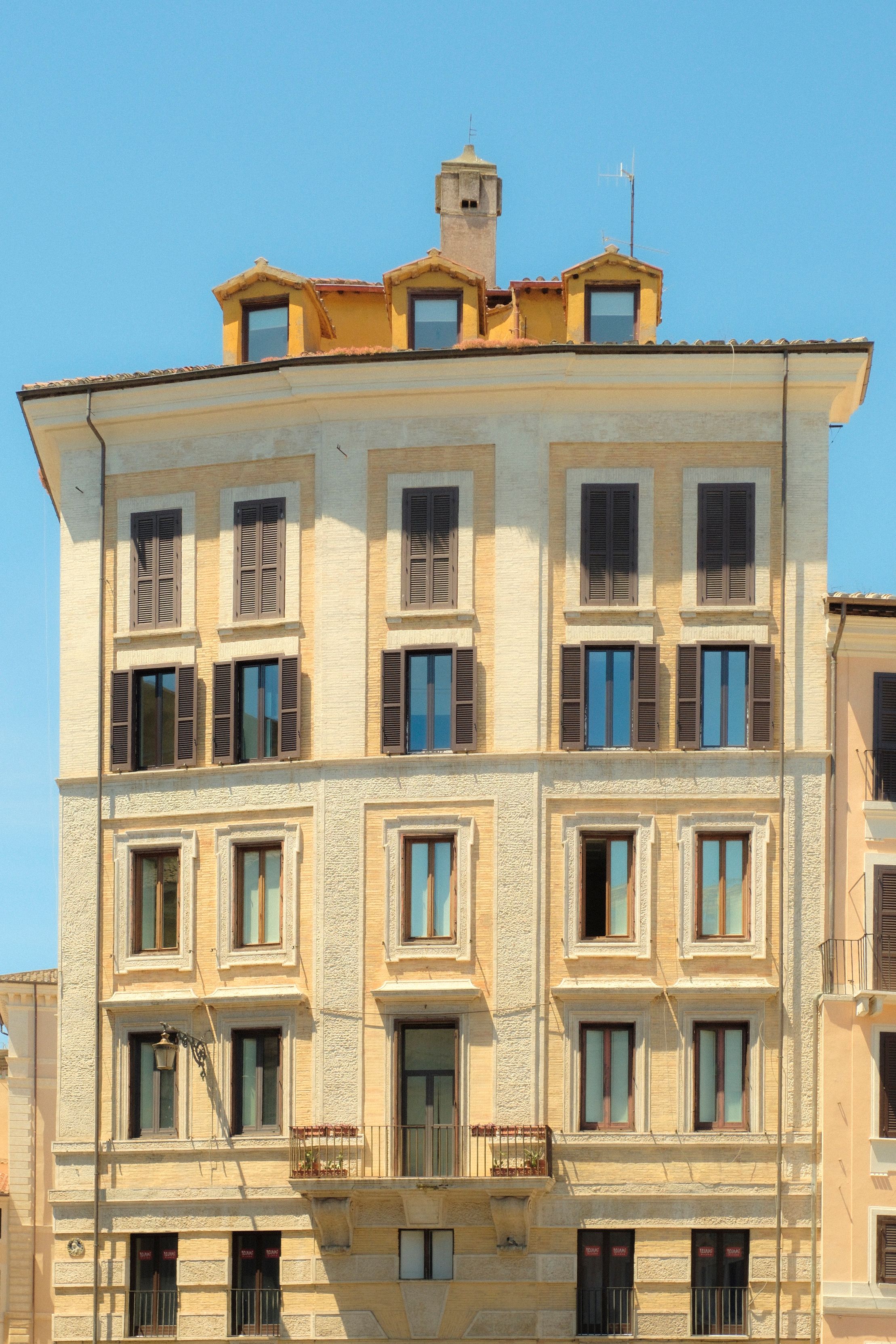 Elegant Historic Building with Shuttered Windows · Free Stock Photo