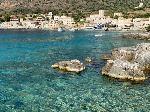 Free Discover the tranquil beauty of Limeni village in Greece with clear turquoise waters and historic architecture. Stock Photo