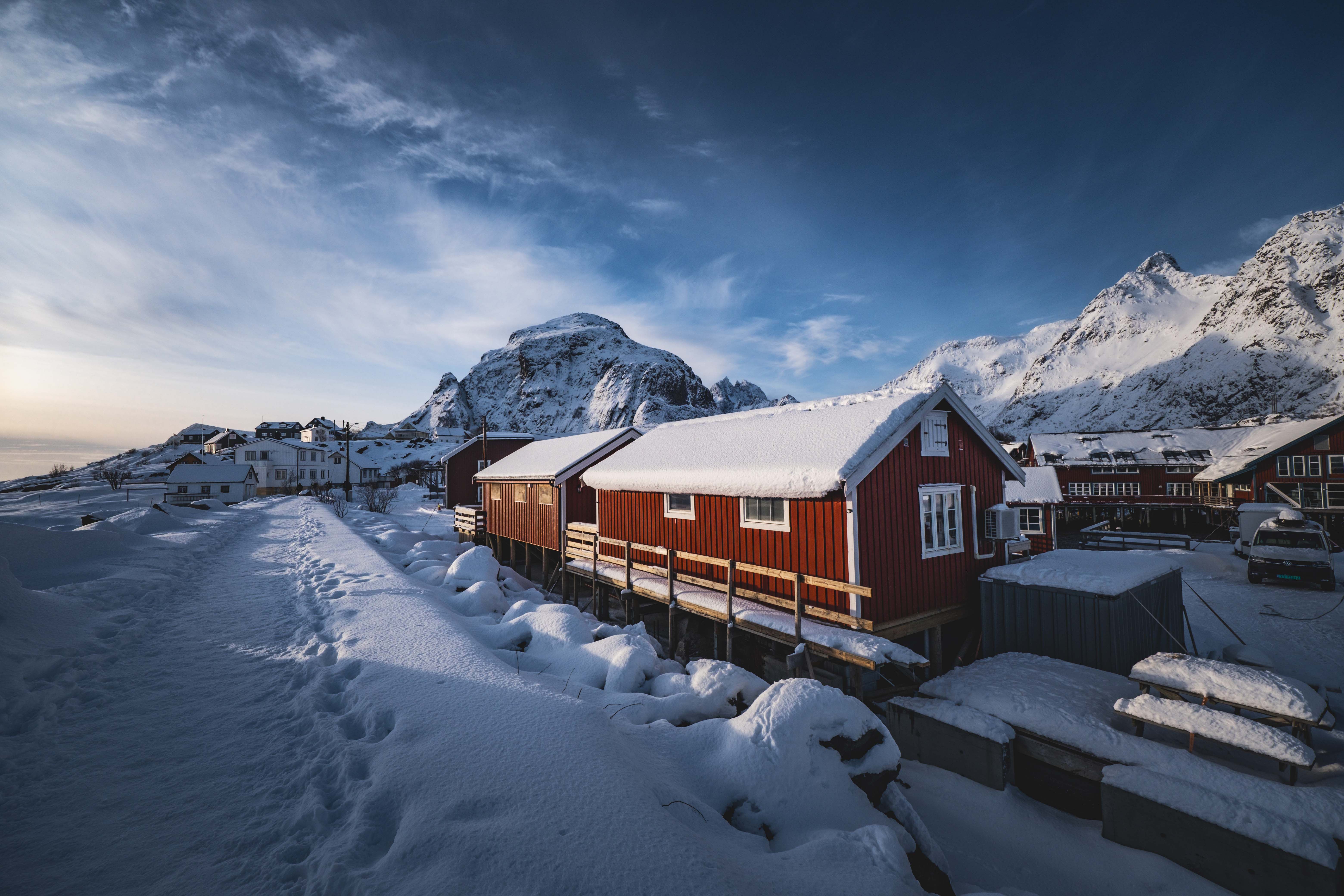 Scenic Winter Village in Snowy Nordic Landscape · Free Stock Photo