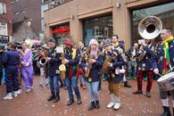 Colorful street band performing during a vibrant carnival parade in Holland.