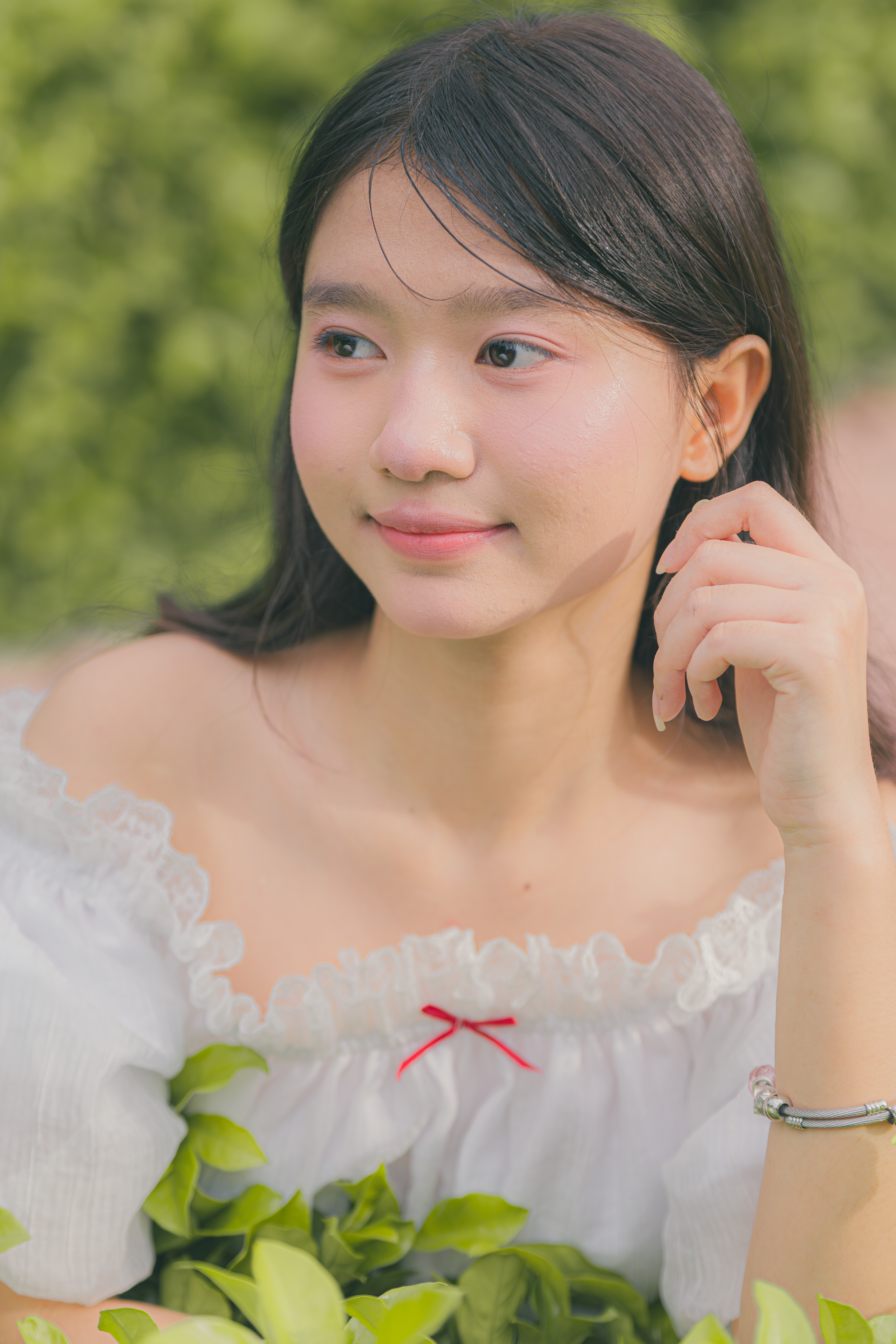 Young Woman in White Dress Amidst Greenery  Free Stock Photo