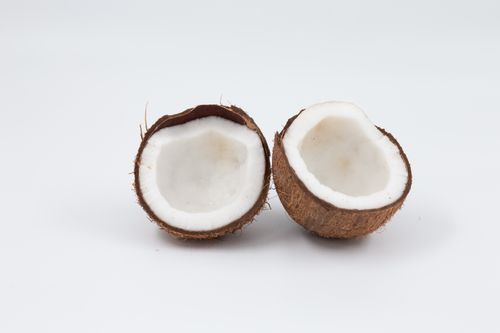 Free High-resolution image of an open coconut showcasing its natural texture and fresh appearance. Stock Photo