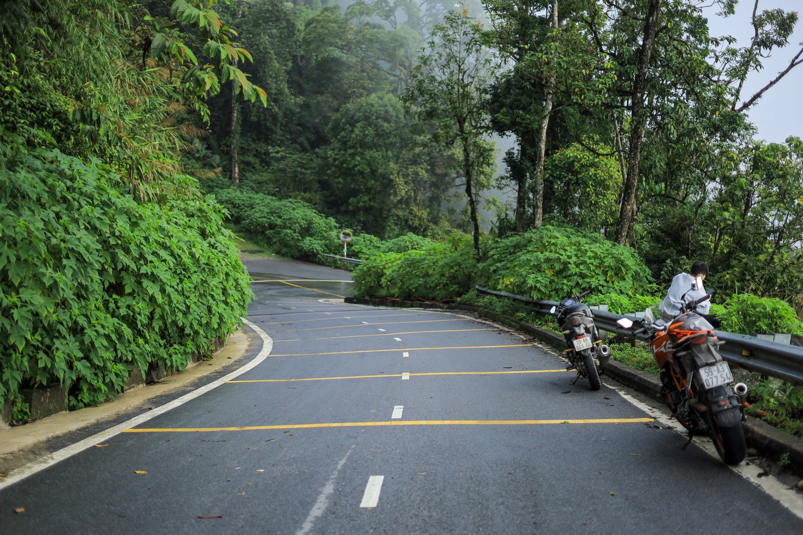 Motorbikes on a scenic mountain road in Vietnam showing the Easy Rider style of travel