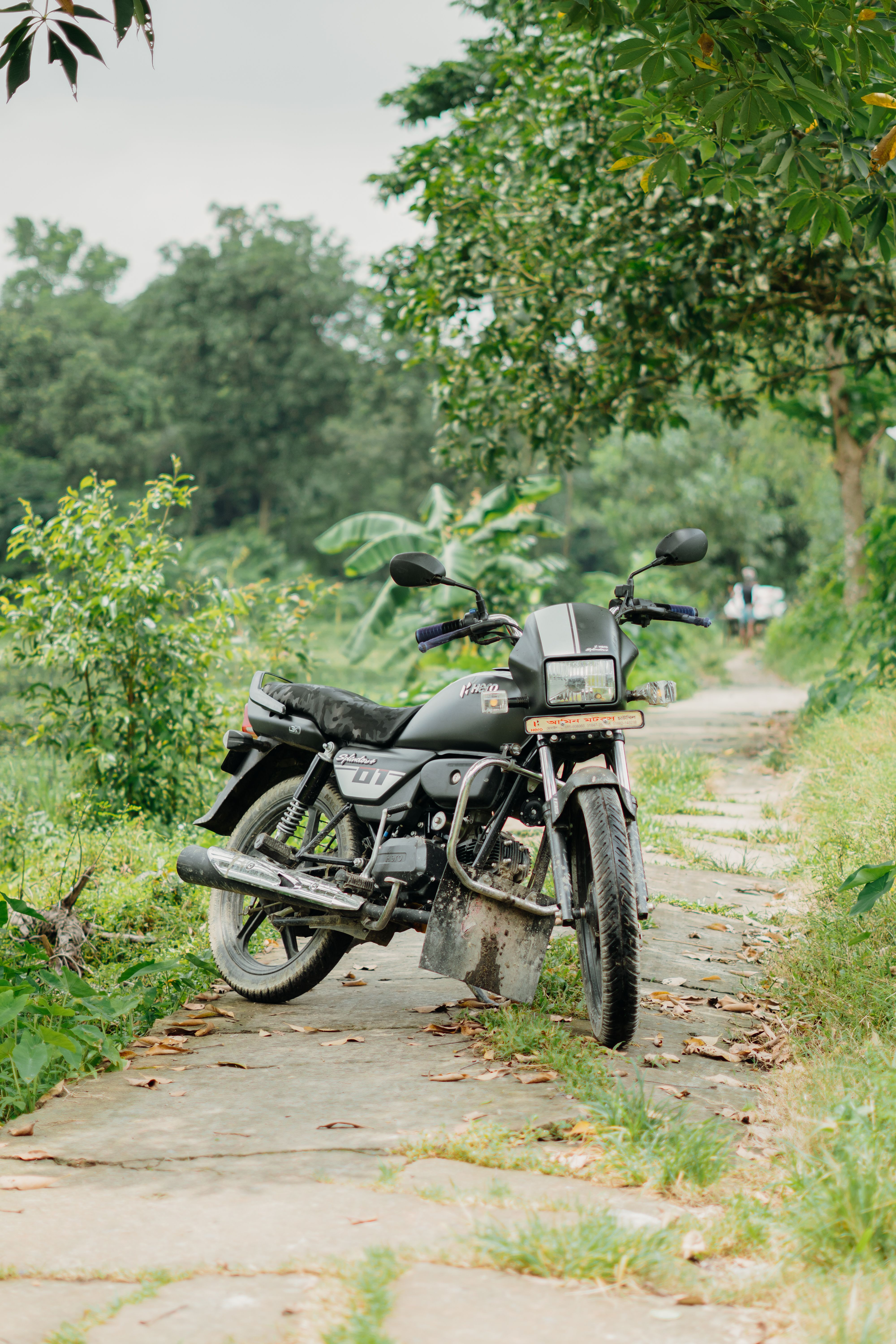 Classic Black Motorcycle on Country Pathway · Free Stock Photo