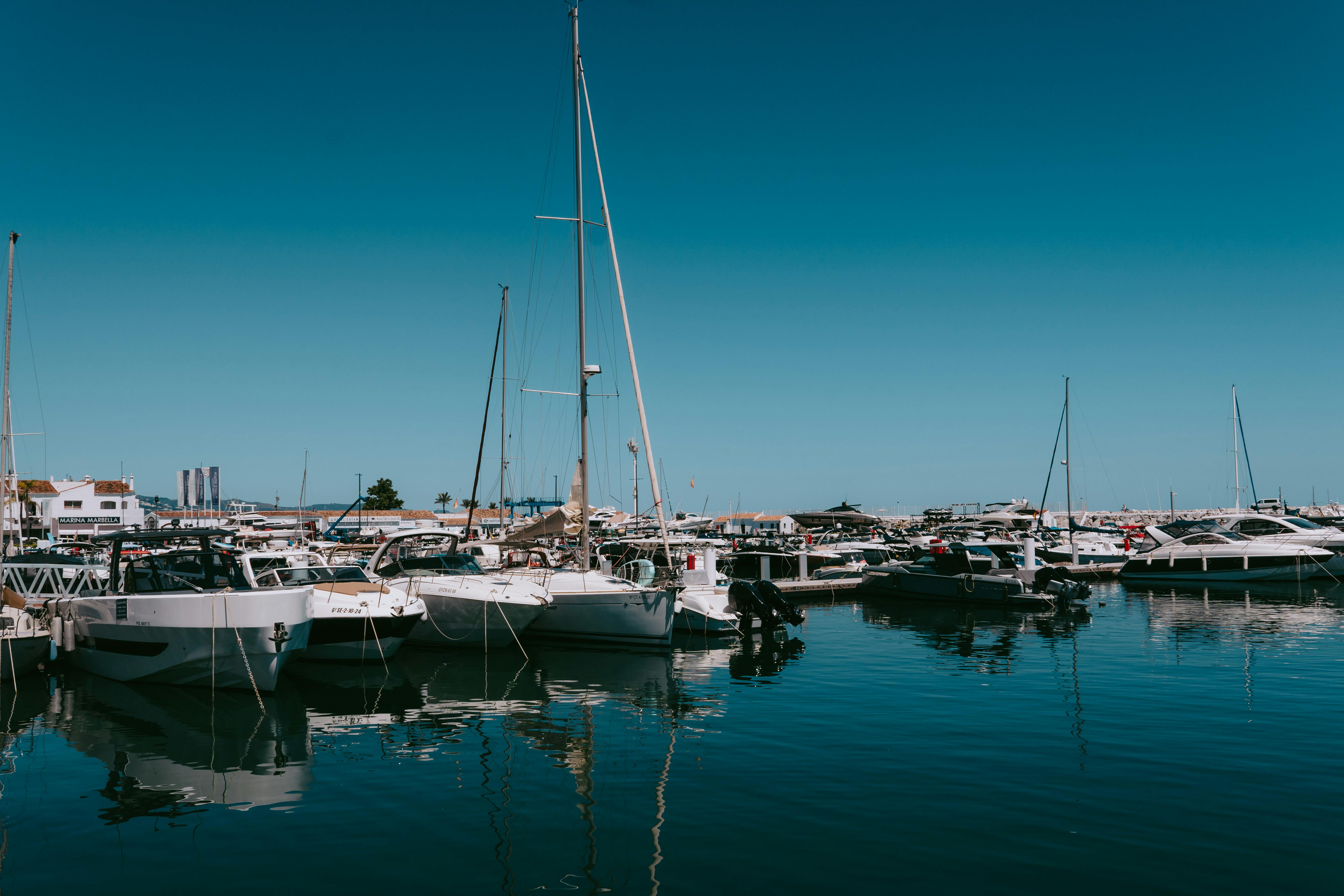 Free Explore the luxurious yachts and boats at Puerto Banus Marina, Marbella, on a sunny day. Stock Photo