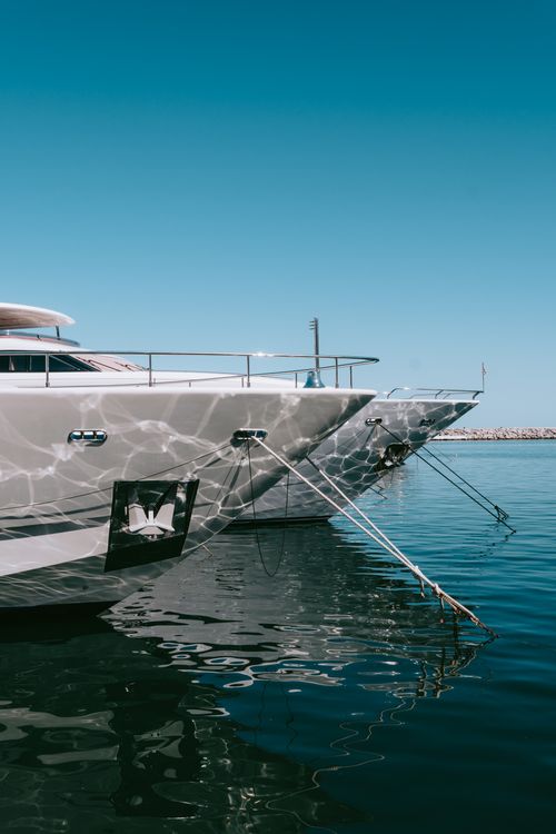 Free Stylish yachts docked at Marbella's sunny marina, reflecting ocean tranquility. Stock Photo