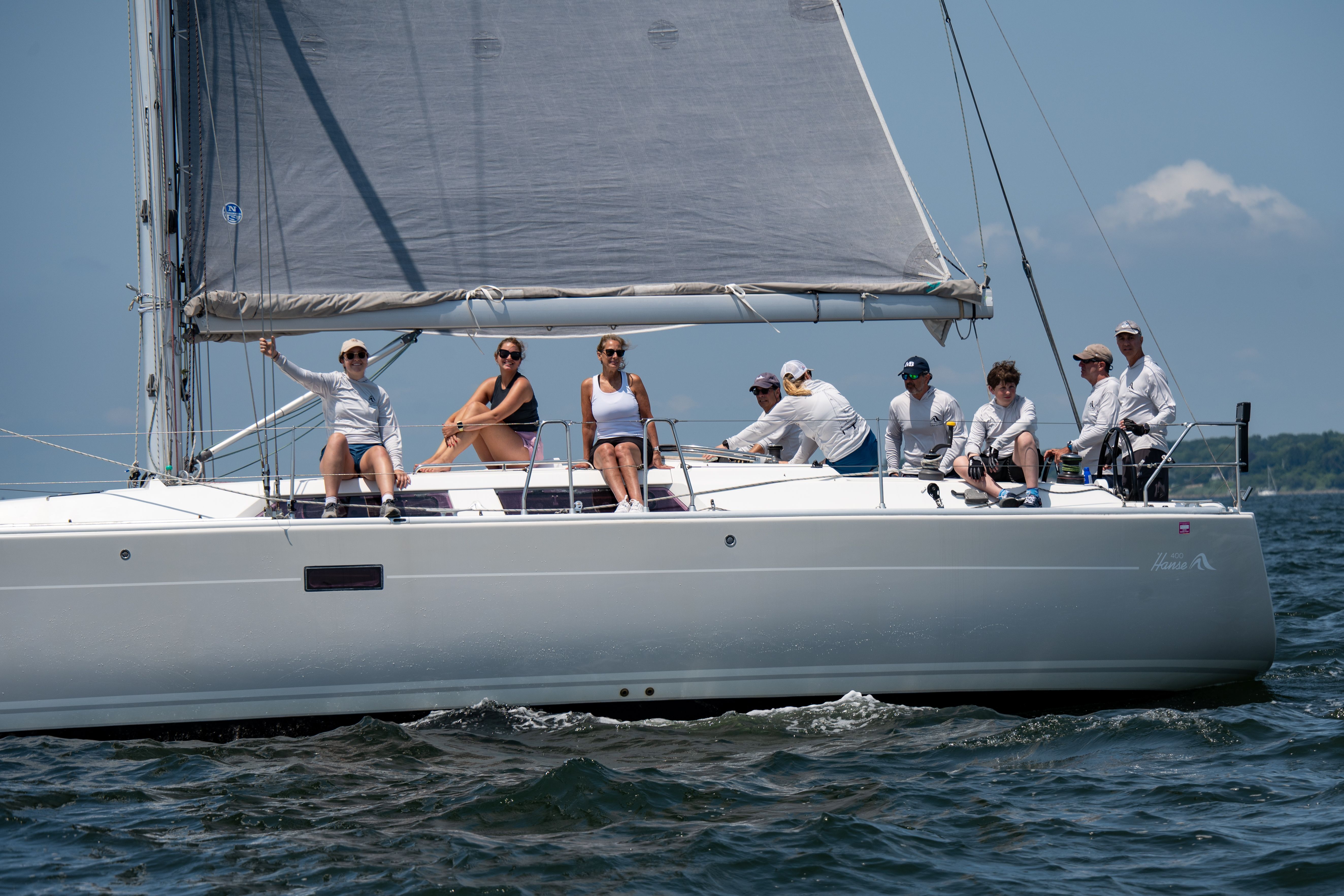 Breathtaking Private Snorkel Trip from Oahu on a Yacht Review: The Ultimate West Oahu Experience Review 2026 - Crew members racing a sailboat in blue waters of Narragansett Bay.