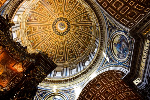 Free Intricate view of St. Peter's Basilica dome ceiling showcasing Renaissance art and architecture. Stock Photo