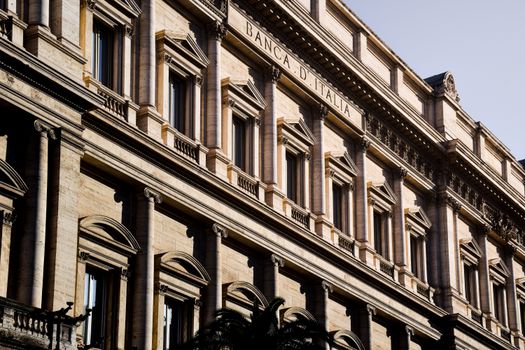 Sunlit facade of the iconic Banca d'Italia in Rome, showcasing classic architecture.
