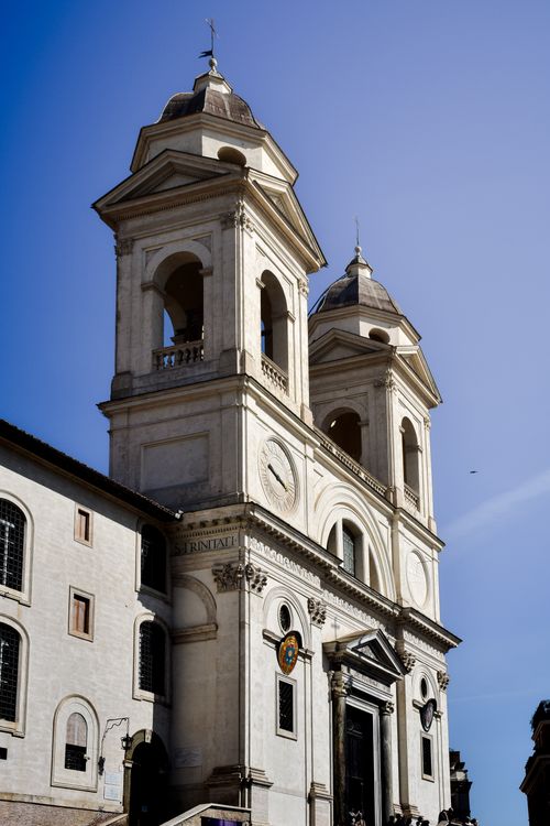 Free A sunny view of the historic Trinità dei Monti Church in Rome, Italy. Stock Photo
