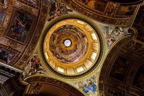 Free Intricate frescoes adorn the grand dome of St. Peter's Basilica, showcasing Renaissance art. Stock Photo