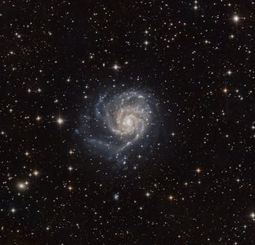 Mesmerizing image of the Pinwheel Galaxy, Messier 101, surrounded by stars in deep space.