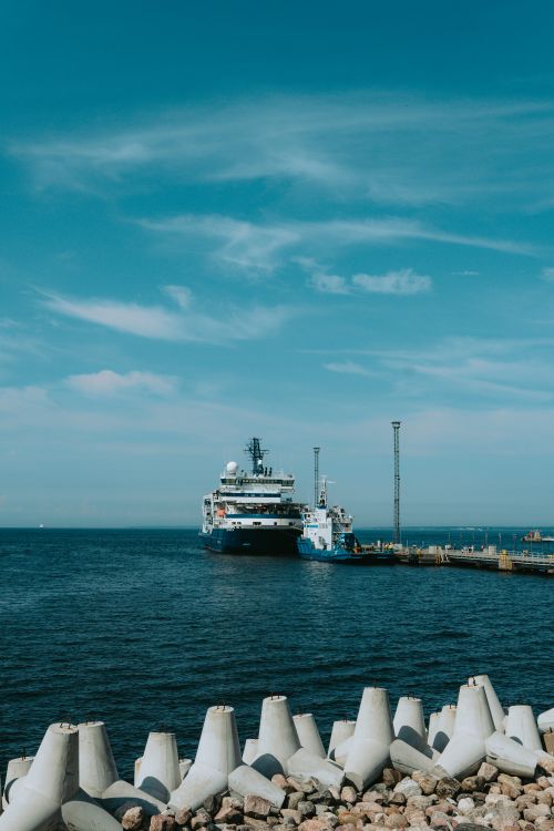Free Cruise ship docked at Tallinn harbor under clear sky, showcasing Estonian coastal beauty. Stock Photo