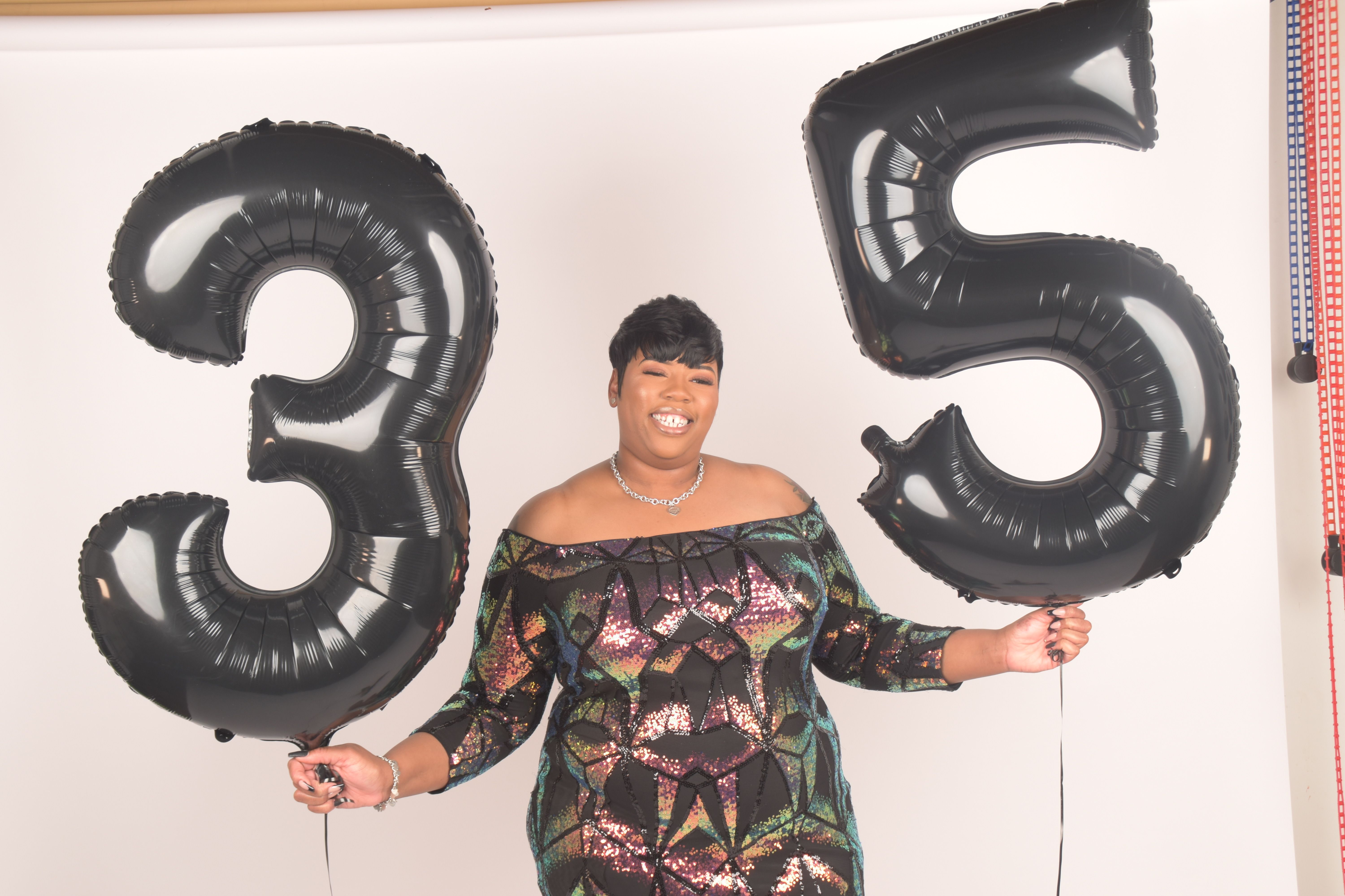 Celebratory Portrait with 35th Birthday Balloons · Free Stock Photo