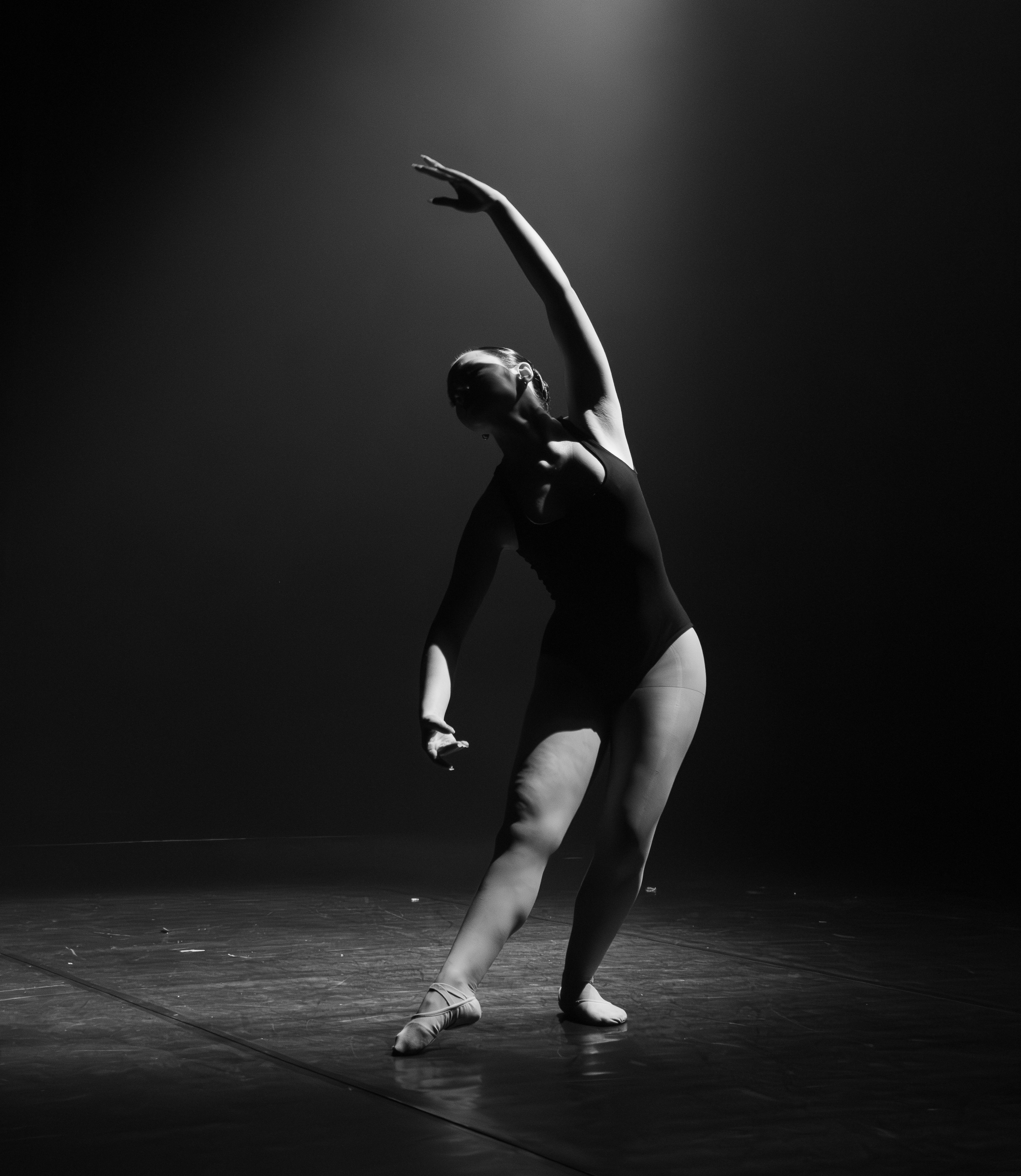 Graceful Ballet Dancer in Dramatic Lighting · Free Stock Photo