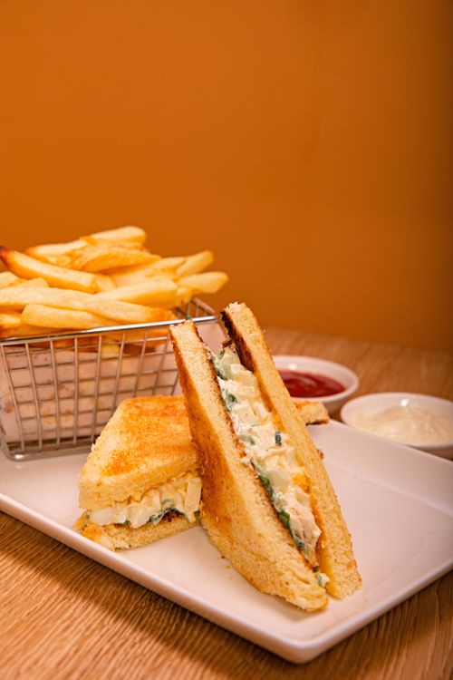 Free Appetizing grilled cheese sandwich with fresh fries and dips on a plate for a satisfying meal. Stock Photo