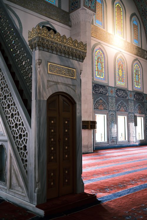 Free Beautiful Ottoman mosque interior featuring ornate decor and stained glass windows, with streaming sunlight. Stock Photo