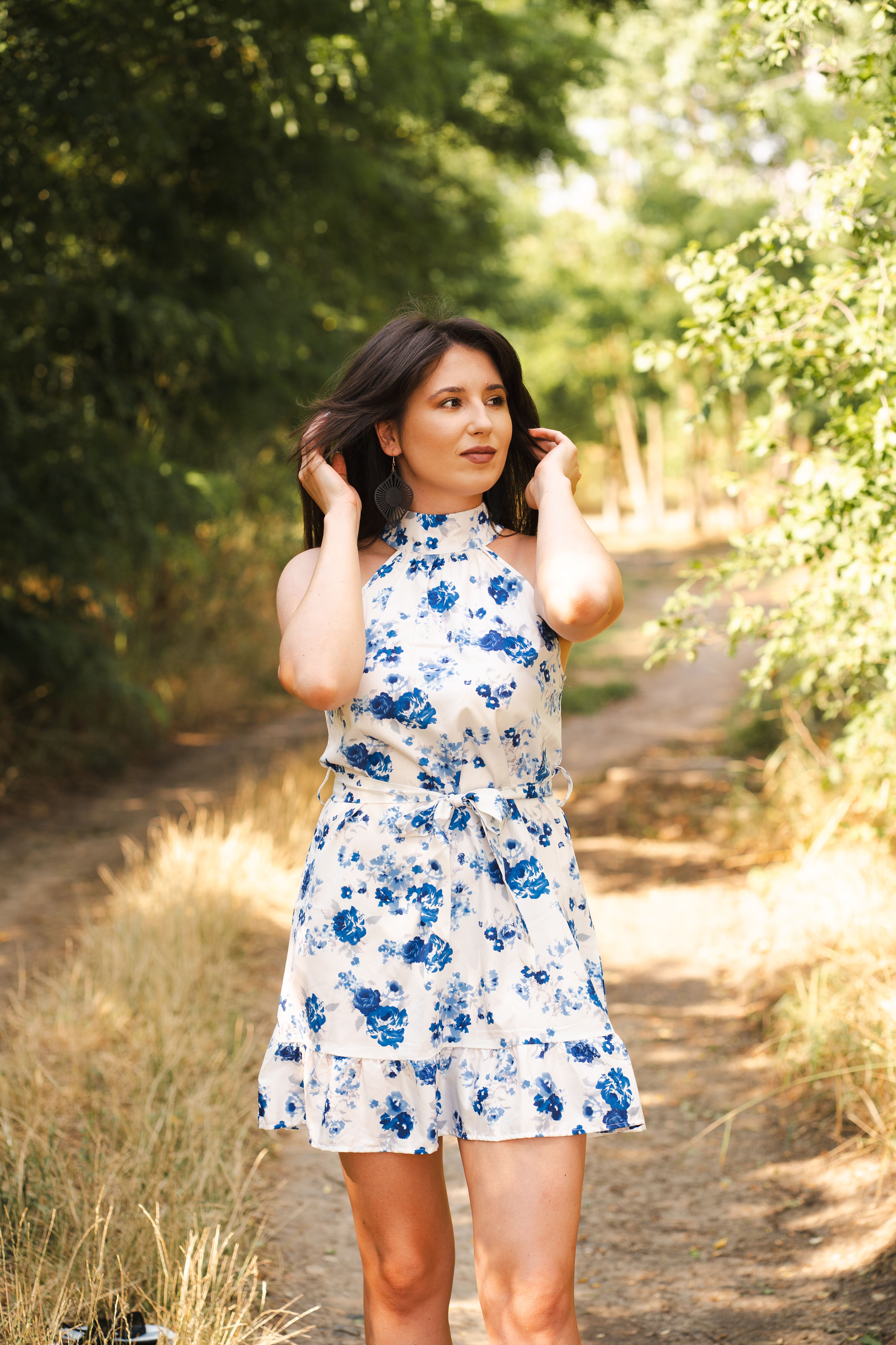 Woman in Floral Dress Enjoying Summer Outdoors · Free Stock Photo