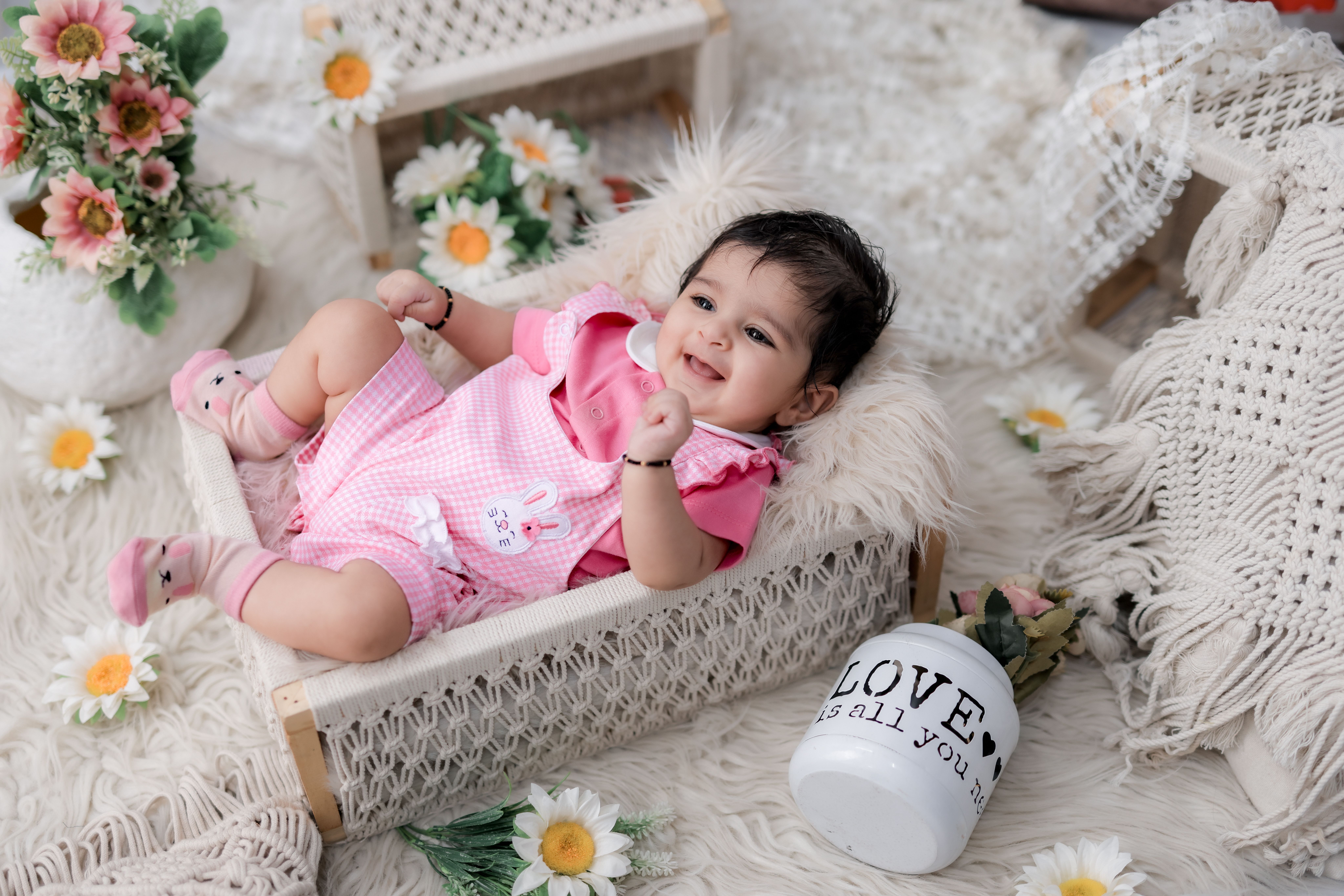 Adorable Baby Girl in Pink with Floral Decor · Free Stock Photo