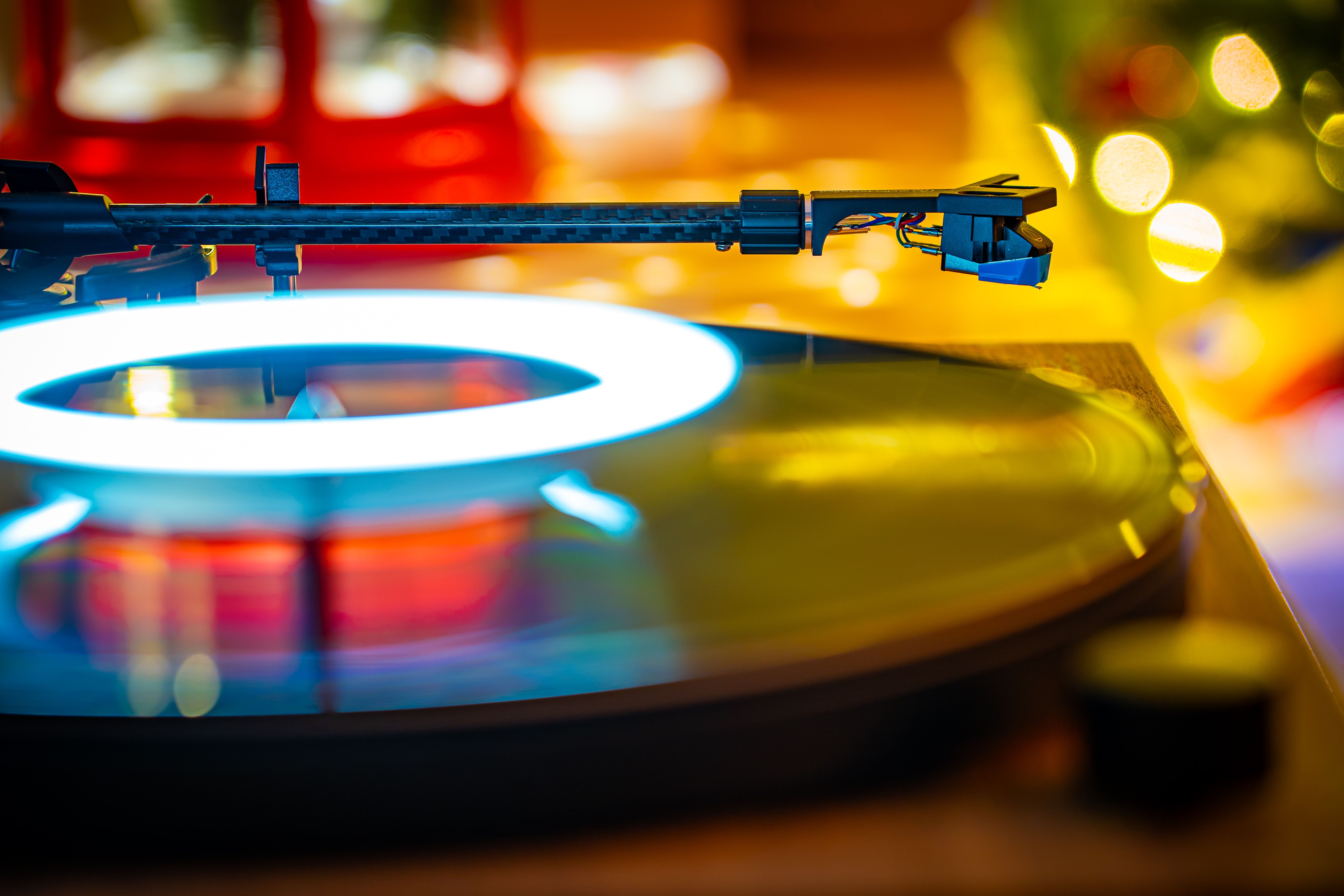 Vibrant Close-Up of Turntable Playing Vinyl Record · Free Stock Photo