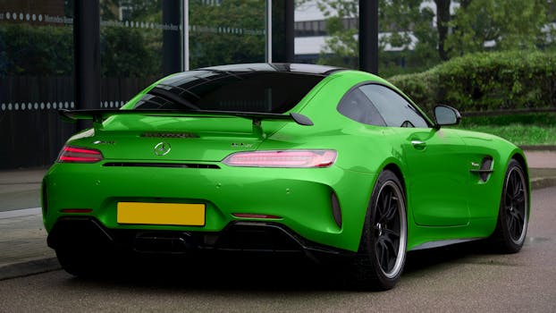 Striking green Mercedes-Benz sports car parked outdoors showcasing sleek design.